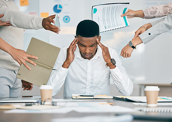 Image showing Stress, burnout and tired black man with headache, frustrated or overwhelmed by coworkers at workplace. Overworked, mental health and anxiety of exhausted male worker multitasking at desk in office.