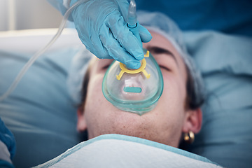 Image showing Anesthesia, oxygen mask and medical with man in surgery for breathing, ventilation and operation. Healthcare, cardiology and paramedic with face of patient and doctors in operating room for emergency