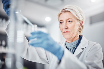 Image showing Senior woman, science beaker and pipette in laboratory for medical research. Scientist, innovation and elderly female doctor experimenting, analysis or testing and researching virus cure with dropper