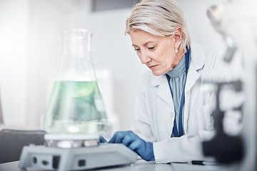 Image showing Senior scientist woman, laboratory and beaker for study, analysis and focus for job in pharma industry. Science, lab and working with pharmaceutical research for vision, future or analytics in Sweden