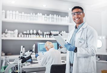 Image showing Science, tablet and portrait of a male scientist doing research with technology in a medical laboratory. Happy, smile and man chemist or biologist working on a mobile device in a pharmaceutical lab.