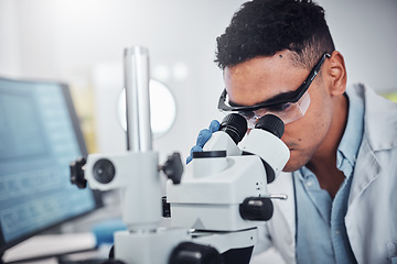 Image showing Science, microscope and man in laboratory for research, testing or medical analysis. Healthcare innovation, scientist and male doctor with equipment to check sample, studying particles or bacteria.