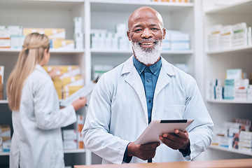 Image showing Portrait, pharmacist or black man with a tablet for healthcare research or medicine list at a drug store or pharmacy clinic. Face, doctor or happy senior worker smiles with pride, goals or trust