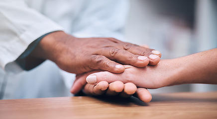 Image showing Hospital, support or doctor holding hands with patient and consulting with medical feedback, news or results. Cancer, zoom or healthcare worker showing empathy, trust or respect to help a sick person