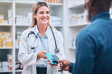 Image showing Pharmacist, payment or customer with credit card for medicine or buying. Pharmacy, woman or black man pay for pills, medical treatment or paying for prescription, clinic dispensary or pharmaceutical
