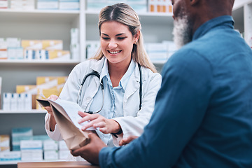 Image showing Healthcare, pharmacist and man at counter, medicine, prescription drugs and happy service at drug store. Health, wellness and medical insurance, black man and woman at pharmacy for advice and pills.