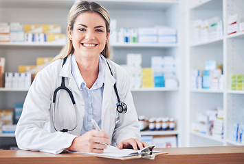 Image showing Portrait, happy or pharmacist writing a checklist of medicine inventory or healthcare stock supply on pharmacy counter. Wellness, trust or face of chemist working on store drugs paperwork with smile