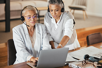 Image showing Customer support, call center and manager helping consultant with an online consultation in the office. Customer service, telemarketing and senior leader consulting agent on laptop in the workplace.