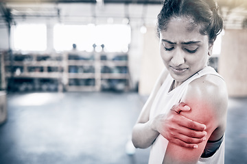 Image showing Woman, fitness and shoulder pain in gym for exercise workout, training accident and sports medical emergency. Sad athlete, arm injury and physical therapy, arthritis or muscle wellness in health club