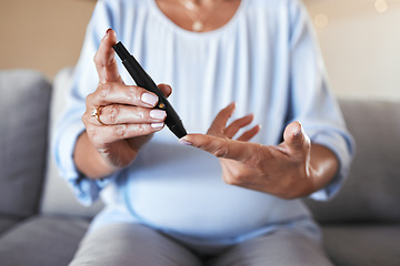 Image showing Pregnant woman, diabetes and finger for sugar test, healthcare wellness and blood check or senior prenatal care on sofa in living room. Mature mother, pregnancy health or self care glucose testing