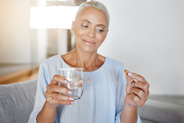 Image showing Senior woman, pregnancy pills and water in home on sofa for ivf healthcare treatment, mother wellness and prenatal care. Elderly woman, drink vitamin medicine and pregnant pharmaceutical support