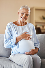 Image showing Pregnant mature woman, smile and relax on sofa in living room for infant health, ivf care and new mother support. Childcare, baby wellness and pregnancy love, happiness and hands on stomach on couch
