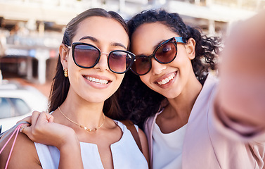 Image showing Selfie, women or friends shopping in city, smile or wealth for luxury clothes, boutique or sale. Customers, ladies or girls with bags, sunglasses or clients with social media, rich or happy in street