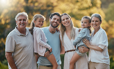 Image showing Love, family and grandparents with girls, parents and smile together for bonding, loving in park. Portrait, grandmother and grandfather with mother, father and daughters for vacation and outdoor.