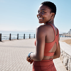 Image showing Black woman, fitness or happy runner thinking of training goals, exercise or cardio workout targets in summer. Smile, wellness or healthy African sports girl at a beach for running, jog or exercising
