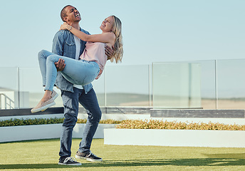 Image showing Diversity, couple love and playful on rooftop for summer vacation, quality time together and marriage bonding. Interracial happy man, women and piggback laughing for fun on building balcony outdoor