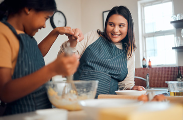 Image showing Mom, girl and cooking with learning, motivation and teaching for cookies, bonding and care in home kitchen. Baking, mother and daughter with celebration, teamwork and fist bump with love in Toronto