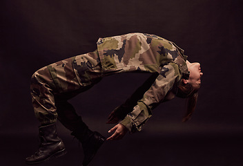 Image showing Military soldier, army woman and depression on a dark studio background for mental health, stress and anxiety problem for trauma. Female in camouflage clothes for art deco of PTSD and psychology