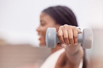 Image showing Fitness, sports or black woman with dumbbell for strong arms, bicep muscles or powerful shoulders in training. Outdoors, blurry or African girl hands weightlifting in a workout or exercise in Nigeria