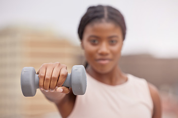 Image showing Fitness, dumbbell or black woman in a city training, workout or arm exercise for strong muscles or growth. Blurry, motivation or healthy African girl exercising for body development on a rooftop