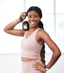 Image showing Black woman, kettlebell portrait and smile for fitness, health and vision for strong body, focus and goals. Gym girl, bodybuilder training and happy for workout, exercise and self care in Atlanta