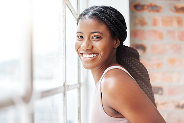 Image showing Face portrait, black woman and smile in gym by window after workout, training or exercise. Sports, wellness or happy female athlete from Nigeria in fitness center on break after exercising for health