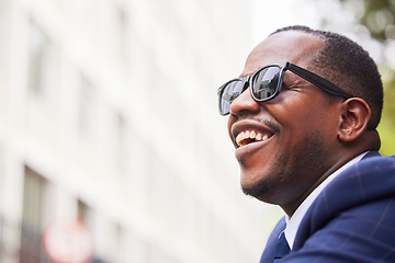 Image showing Black man, face and glasses happy in city for business travel, work commute or walking in street. African american businessman, smile and walk with sunglasses in urban town or New York traveller