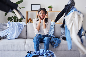 Image showing Stress, burnout and laundry with black woman and anxiety about house work and housekeeping, cleaning service fail and fear in family home. Cleaning, stressed and spring cleaning fatigue with textile.