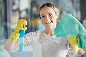 Image showing Happy woman, window cleaning spray and bottle with cloth for dust, bacteria or dirt in apartment, home and Australia. Portrait of maid, housekeeping and cleaner wipe glass, door or chemical detergent