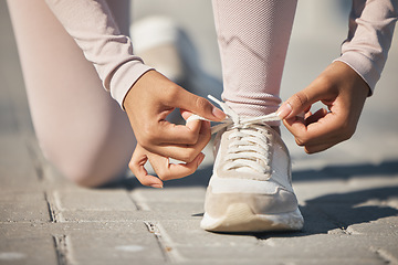 Image showing Ready, fitness and tie shoes of a woman in the street for a race, marathon or cardio running in city of Sweden. Exercise start, health and athlete laces for training motivation, sports and workout