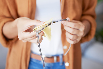 Image showing Cleaning glasses, cloth and woman hands doing eye care with fabric to clean lens and frame. Dust, dirt and care of a person at a optometrist or doctor office getting ready for vision test for health