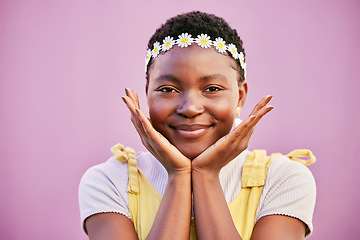Image showing Black woman, flower crown and smile in portrait by pink background for beauty, makeup and cosmetics. Happy african woman, hands and face for cosmetic glow, radiant and flowers for spring in Baltimore