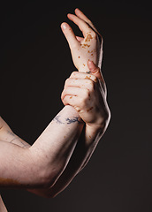 Image showing Hand, vitiligo and man in studio for skincare, grooming and hygiene against black background with mockup. Hands, skin and guy model with melanin, pigmentation and product for body positivity mock up