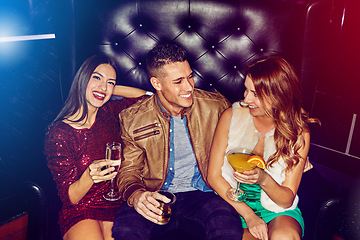 Image showing Friends, club and party drinking alcohol at disco event, concert or happy hour for new years celebration together. Man and women with smile relaxing, clubbing and having fun at rave or nightclub