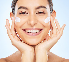 Image showing Portrait, skincare and moisturizer with a model woman in studio on a gray background for antiaging beauty. Face, lotion and product with an attractive young female inside to apply facial treatment