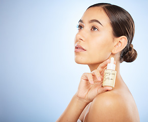 Image showing Skincare, beauty and face of woman with serum for skincare products, facial treatment and dermatology. Healthcare, wellness and female advertising natural oil, beauty products and cosmetics in studio