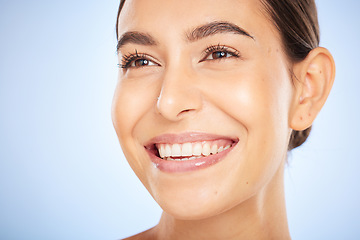 Image showing Skincare model face, smile and beauty by blue background for wellness, radiant glow and cosmetics. Woman, studio background and happy for self care, cosmetic and soft facial skin for aesthetic shine