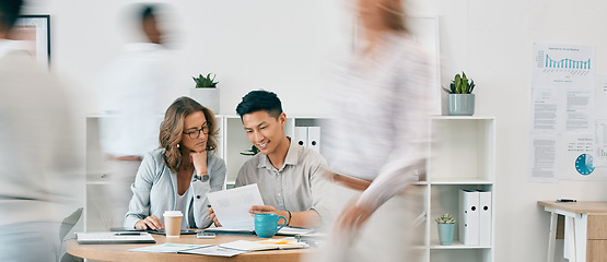 Image showing Teamwork, documents and business people in office for review or discussion. Paperwork, collaboration or Asian man and woman at desk in busy workplace planning sales, advertising or marketing strategy