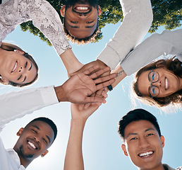 Image showing Team hands, face and happy employee support for business success, diversity solidarity and collaboration outdoor. Teamwork, interracial employees and team building holding hands together for goals