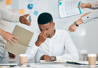 Image showing Stress, burnout and tired black man with headache, frustrated or overwhelmed by coworkers at workplace. Overworked, mental health and anxiety of exhausted male worker multitasking at desk in office.