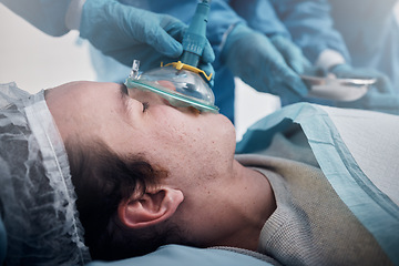 Image showing Anesthesia, oxygen mask and medical with man in surgery for breathing, ventilation and operation. Healthcare, cardiology and paramedic with face of patient and doctors in operating room for emergency