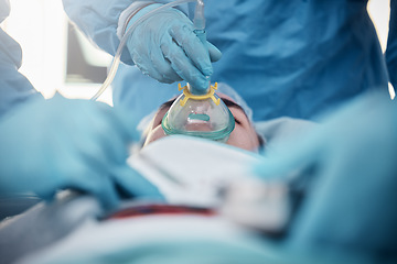 Image showing Doctors, surgery and oxygen mask with a medicine team in scrubs operating on a man patient in a hospital. Doctor, nurse and teamwork with a medical group in a clinic to perform an emergency operation