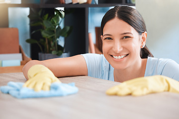 Image showing Cleaning, woman or portrait happy cleaner with cloth and gloves for dusty, messy or dirty bacteria on wooden table. Smile, cleaning service or girl wipes germs furniture surface in home office room