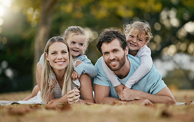 Image showing Family, park and portrait of parents with kids enjoy summer holiday, weekend and quality time outdoors. Love, picnic and happy mom, father and children smiling, bonding and relax together in nature