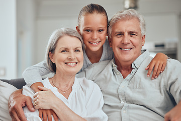 Image showing Love, family and portrait by girl and grandparents on sofa for bond, hug and quality time in their home together. Happy family, face and senior man with woman relax with grandchild while babysitting