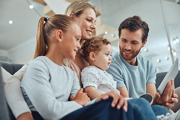 Image showing Living room, tablet and happy family streaming a movie online while relaxing on a sofa together at home. Mother, father and children watching video on social media or the internet with mobile device.