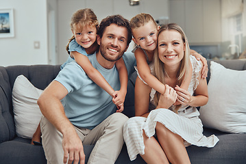 Image showing Portrait, mother and father with girls, smile and bonding on sofa for break, quality time and happiness. Love, family and parents with daughters, loving and joy for childcare, mama and dad with kids.