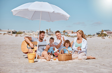 Image showing Beach, picnic or happy family love guitar music while bonding or relaxing on summer holiday vacation. Grandfather, dad and mother enjoying quality time with children siblings eating watermelon fruit