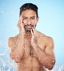 Image showing Portrait, water splash or man in shower in studio cleaning his face or body for beauty, skincare or self love. Wellness, luxury or healthy male model washing body in natural grooming morning routine
