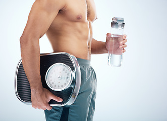 Image showing Man, water bottle or scale for body fitness, workout or training progress in healthcare wellness, diet control or muscle growth. Sports athlete, personal trainer or coach with weight scale or drink